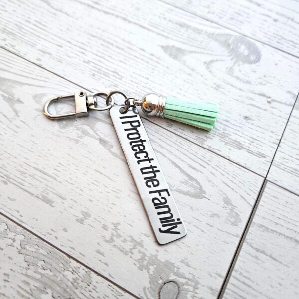 il_fullxfull.7581637868_hzaa-1 I Protect the Family Keychain • Stainless Steel Bar with Tassel