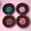 ✨ The perfect blend of natural beauty and handcrafted artistry! These handmade bamboo ring dishes bring warmth and elegance to your space, with a rich chocolate brown hand-painted finish and a stunning resin floral centerpiece. The bowls are upcycled and rescued from a local thrift store and lovingly re-finished and upgraded. Each 3.5-inch round bamboo bowl is sanded smooth and carefully hand-painted, creating a luxurious, earthy base for the delicate hand-cast resin flowers. Choose from four st