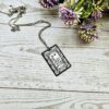 Gatsby Book Necklace – Mirror Polish Stainless Steel Literary Pendant 2 Great Gatsby miniature book pendant — mirror-polish stainless steel, engraved in-house. Tarnish-proof literary jewelry for the classic literature lover. “So we beat on, boats against the current...” 🍸✨ Capture the glittering allure of West Egg with our Mirror Polish Great Gatsby Necklace. This isn't just a book charm; it’s a high-shine statement piece designed for those who find beauty in the classics. Crafted from 304 Stainless Steel and polished to a brilliant, reflective finish, it mimics the (2)