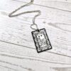 Gatsby Book Necklace – Mirror Polish Stainless Steel Literary Pendant 6 Great Gatsby miniature book pendant — mirror-polish stainless steel, engraved in-house. Tarnish-proof literary jewelry for the classic literature lover. “So we beat on, boats against the current...” 🍸✨ Capture the glittering allure of West Egg with our Mirror Polish Great Gatsby Necklace. This isn't just a book charm; it’s a high-shine statement piece designed for those who find beauty in the classics. Crafted from 304 Stainless Steel and polished to a brilliant, reflective finish, it mimics the (6)