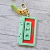 il_fullxfull.7581660744_hamc-2 Showgirl Era Cassette Keychain – Personalized Retro Mixtape Bag Charm with Tassel