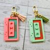 il_fullxfull.7581661030_cavd-2 Showgirl Era Cassette Keychain – Personalized Retro Mixtape Bag Charm with Tassel