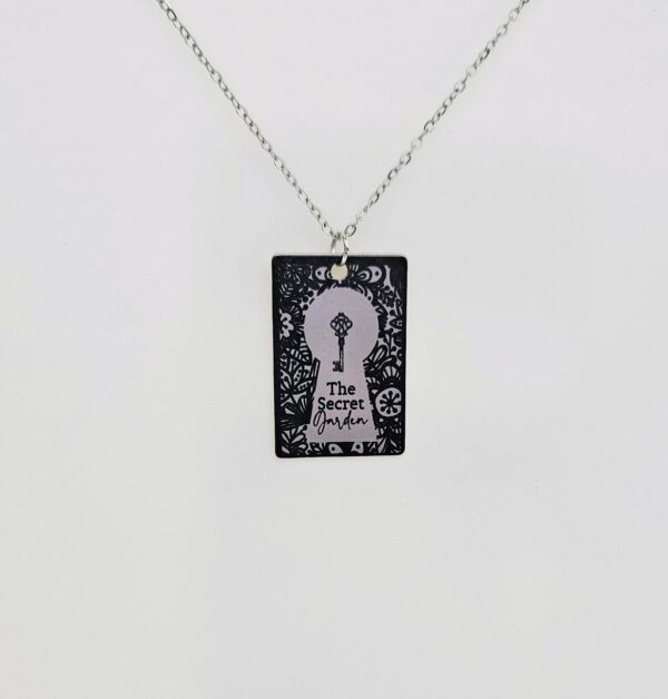 Secret Garden Book Necklace – Engraved Miniature Book Pendant – Literary Jewelry Gift 3 Secret Garden miniature book pendant — mirror-polish stainless steel, engraved in-house. Cottagecore literary gift for the book lover, gardener, or dreamer. “If you look the right way, you can see that the whole world is a garden.” 🌿🗝️ Unlock a bit of magic with our Secret Garden Book Necklace. A tribute to Frances Hodgson Burnett’s beloved tale of hidden beauty and second chances, this pendant is designed for the dreamers who believe in the power of growth. Whether you’re a lifelong reader or a (3)