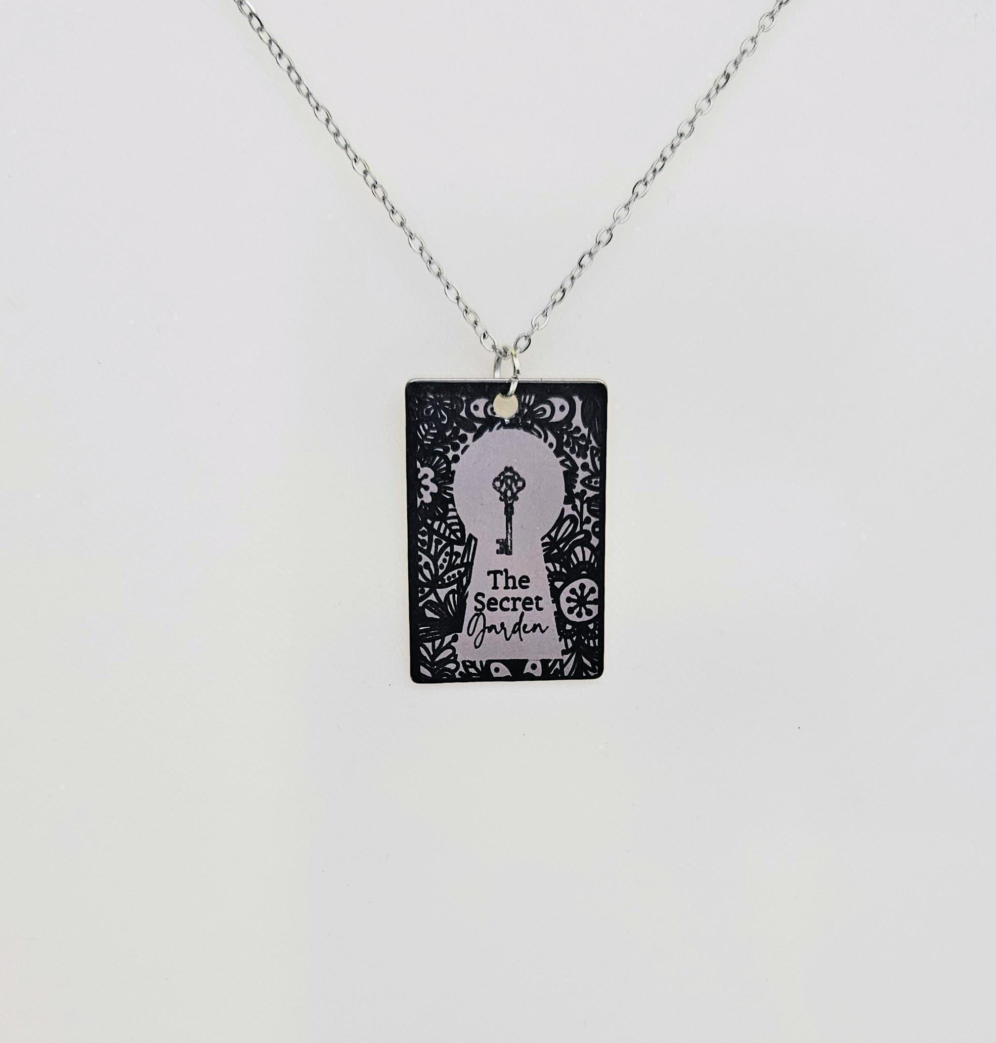 Secret Garden miniature book pendant — mirror-polish stainless steel, engraved in-house. Cottagecore literary gift for the book lover, gardener, or dreamer. “If you look the right way, you can see that the whole world is a garden.” 🌿🗝️ Unlock a bit of magic with our Secret Garden Book Necklace. A tribute to Frances Hodgson Burnett’s beloved tale of hidden beauty and second chances, this pendant is designed for the dreamers who believe in the power of growth. Whether you’re a lifelong reader or a (3)