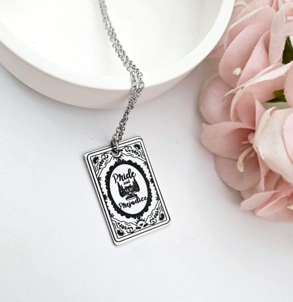 Pride and Prejudice Book Necklace – Jane Austen Literary Jewelry – Romantic Gift for Her 1 Miniature Pride and Prejudice book pendant — engraved stainless steel, mirror-polish finish. Jane Austen jewelry for the romantic reader. Tarnish-proof. "You have bewitched me, body and soul." 🥀📖 Whether you're a Lizzie or a Darcy, our Pride and Prejudice Book Necklace is the ultimate tribute to the world’s most famous enemies-to-lovers story. Crafted from high-grade 304 Stainless Steel and polished to a stunning mirror finish, this pendant is designed for the dreamers, the readers, and the ones (1)