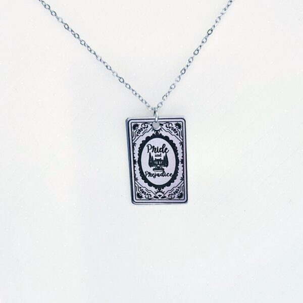 Pride and Prejudice Book Necklace – Jane Austen Literary Jewelry – Romantic Gift for Her 8 Miniature Pride and Prejudice book pendant — engraved stainless steel, mirror-polish finish. Jane Austen jewelry for the romantic reader. Tarnish-proof. "You have bewitched me, body and soul." 🥀📖 Whether you're a Lizzie or a Darcy, our Pride and Prejudice Book Necklace is the ultimate tribute to the world’s most famous enemies-to-lovers story. Crafted from high-grade 304 Stainless Steel and polished to a stunning mirror finish, this pendant is designed for the dreamers, the readers, and the ones (8)