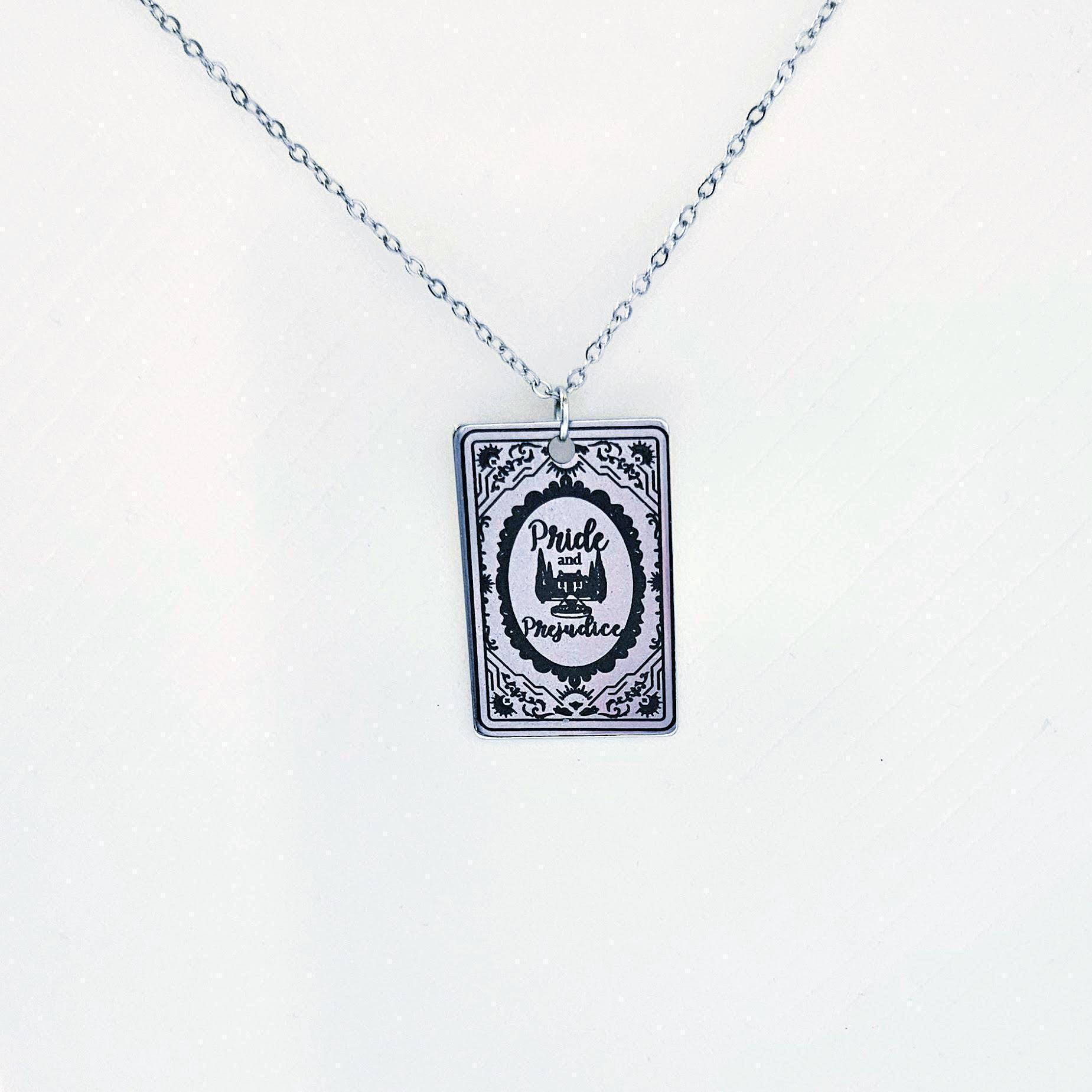 Miniature Pride and Prejudice book pendant — engraved stainless steel, mirror-polish finish. Jane Austen jewelry for the romantic reader. Tarnish-proof. "You have bewitched me, body and soul." 🥀📖 Whether you're a Lizzie or a Darcy, our Pride and Prejudice Book Necklace is the ultimate tribute to the world’s most famous enemies-to-lovers story. Crafted from high-grade 304 Stainless Steel and polished to a stunning mirror finish, this pendant is designed for the dreamers, the readers, and the ones (8)