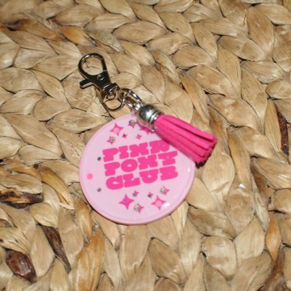il_fullxfull.7581665082_lt29 Pink Pony Club Motel Keychain Round Keychain with Tassel