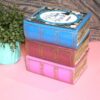 Resin Book Box: 'Fuck Around and Find Out - Handcrafted Storage for Book Lovers 8 Hide your treasures in plain sight with this handmade resin book box—a sassy and stylish storage solution for any book lover! Designed to blend seamlessly into your bookshelf or desk, this epoxy resin book box is both functional and eye-catching. ✨ Features: 📖 Handcrafted with high-quality tinted epoxy resin – durable, glossy, and built to last. 🎨 Hand-painted page details – complete with gold accents on the edges and spine for that luxury book aesthetic. 💖 Custom-designed cover – featuring a pi (8)