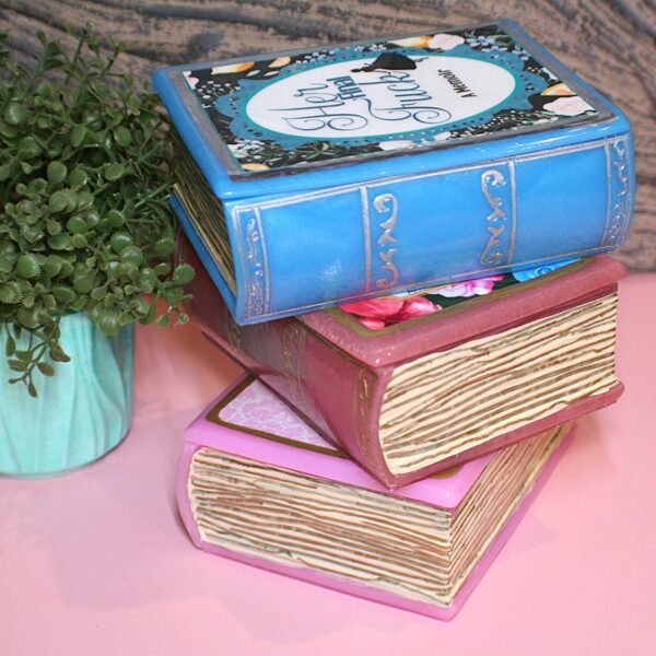 Resin Book Box: 'Fuck Around and Find Out - Handcrafted Storage for Book Lovers 9 Hide your treasures in plain sight with this handmade resin book box—a sassy and stylish storage solution for any book lover! Designed to blend seamlessly into your bookshelf or desk, this epoxy resin book box is both functional and eye-catching. ✨ Features: 📖 Handcrafted with high-quality tinted epoxy resin – durable, glossy, and built to last. 🎨 Hand-painted page details – complete with gold accents on the edges and spine for that luxury book aesthetic. 💖 Custom-designed cover – featuring a pi (9)