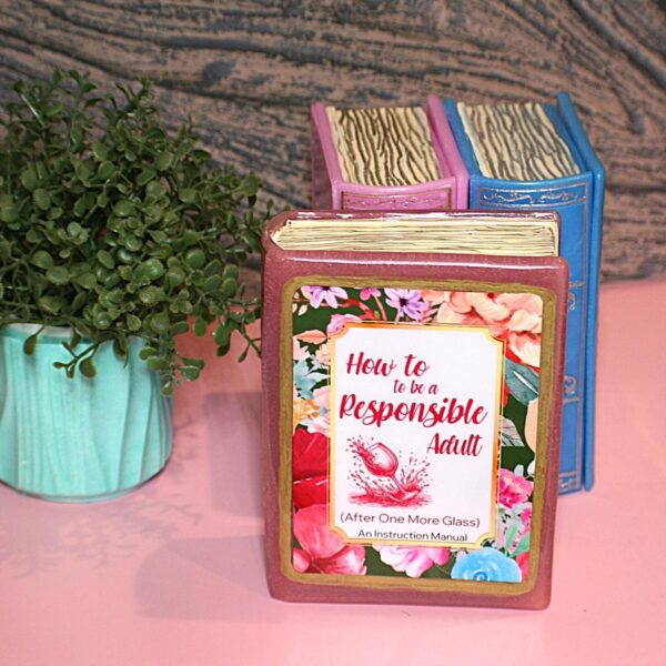 Funny Resin Book Box: 'How to be a Responsible Adult' - Handmade Storage for Book Lovers 1 Because responsibility can wait until the next pour. 🍷📖 Meet your new favorite secret stash spot—a stunning jelly rose red resin book box that’s equal parts classy and cheeky. Whether it’s perched on your bookshelf, desk, or bar cart, this handmade epoxy resin box is designed for those who appreciate a touch of luxury with their humor. Makes the perfect gift for you booktok bestie or yourself! ✨ Features: 📖 Crafted from high-quality tinted epoxy resin – with a translucent jelly rose red finish t (1)