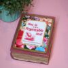 Funny Resin Book Box: 'How to be a Responsible Adult' - Handmade Storage for Book Lovers 2 Because responsibility can wait until the next pour. 🍷📖 Meet your new favorite secret stash spot—a stunning jelly rose red resin book box that’s equal parts classy and cheeky. Whether it’s perched on your bookshelf, desk, or bar cart, this handmade epoxy resin box is designed for those who appreciate a touch of luxury with their humor. Makes the perfect gift for you booktok bestie or yourself! ✨ Features: 📖 Crafted from high-quality tinted epoxy resin – with a translucent jelly rose red finish t (2)