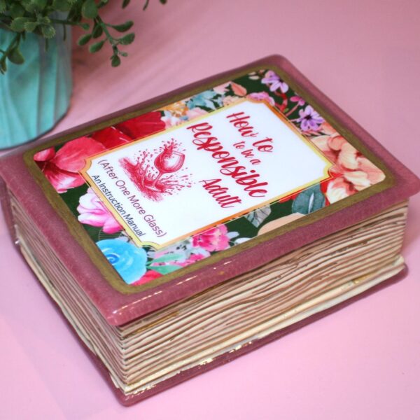 Funny Resin Book Box: 'How to be a Responsible Adult' - Handmade Storage for Book Lovers 6 Because responsibility can wait until the next pour. 🍷📖 Meet your new favorite secret stash spot—a stunning jelly rose red resin book box that’s equal parts classy and cheeky. Whether it’s perched on your bookshelf, desk, or bar cart, this handmade epoxy resin box is designed for those who appreciate a touch of luxury with their humor. Makes the perfect gift for you booktok bestie or yourself! ✨ Features: 📖 Crafted from high-quality tinted epoxy resin – with a translucent jelly rose red finish t (6)