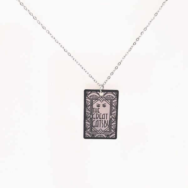 Gatsby Book Necklace – Mirror Polish Stainless Steel Literary Pendant 5 Great Gatsby miniature book pendant — mirror-polish stainless steel, engraved in-house. Tarnish-proof literary jewelry for the classic literature lover. “So we beat on, boats against the current...” 🍸✨ Capture the glittering allure of West Egg with our Mirror Polish Great Gatsby Necklace. This isn't just a book charm; it’s a high-shine statement piece designed for those who find beauty in the classics. Crafted from 304 Stainless Steel and polished to a brilliant, reflective finish, it mimics the (5)