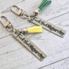 Fuck the Oligarchy Keychain with Tassel – Feminist Stainless Steel Statement Accessory