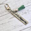 Fuck the Oligarchy Keychain with Tassel – Feminist Stainless Steel Statement Accessory