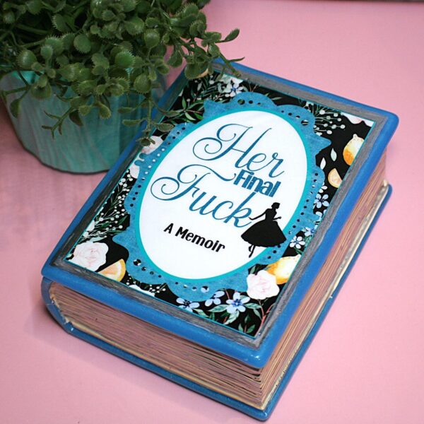 Handmade Resin Book Box: "Her Final Fuck... A Memoir" - Blue Floral Keepsake Storage 3 Some books hold stories—this one holds secrets. 💙✨ Introducing the handmade resin book box in a striking bright blue hue, designed for book lovers who appreciate a little edge with their elegance. Crafted with tinted epoxy resin, this durable and stylish storage box blends effortlessly into your bookshelf, making it the perfect spot to stash your small treasures. ✨ Features: 📖 Expertly crafted from high-quality epoxy resin – glossy, sturdy, and built to last. The boxes can stand a drop but will (3)