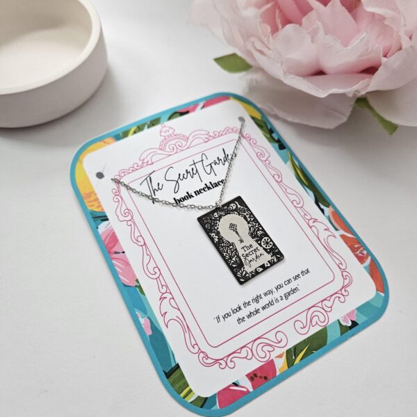 Secret Garden Book Necklace – Engraved Miniature Book Pendant – Literary Jewelry Gift 1 Secret Garden miniature book pendant — mirror-polish stainless steel, engraved in-house. Cottagecore literary gift for the book lover, gardener, or dreamer. “If you look the right way, you can see that the whole world is a garden.” 🌿🗝️ Unlock a bit of magic with our Secret Garden Book Necklace. A tribute to Frances Hodgson Burnett’s beloved tale of hidden beauty and second chances, this pendant is designed for the dreamers who believe in the power of growth. Whether you’re a lifelong reader or a (1)
