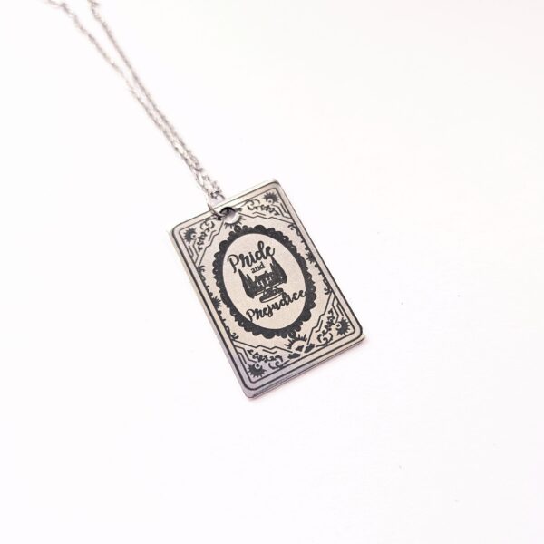 Pride and Prejudice Book Necklace – Jane Austen Literary Jewelry – Romantic Gift for Her 3 Miniature Pride and Prejudice book pendant — engraved stainless steel, mirror-polish finish. Jane Austen jewelry for the romantic reader. Tarnish-proof. "You have bewitched me, body and soul." 🥀📖 Whether you're a Lizzie or a Darcy, our Pride and Prejudice Book Necklace is the ultimate tribute to the world’s most famous enemies-to-lovers story. Crafted from high-grade 304 Stainless Steel and polished to a stunning mirror finish, this pendant is designed for the dreamers, the readers, and the ones (3)