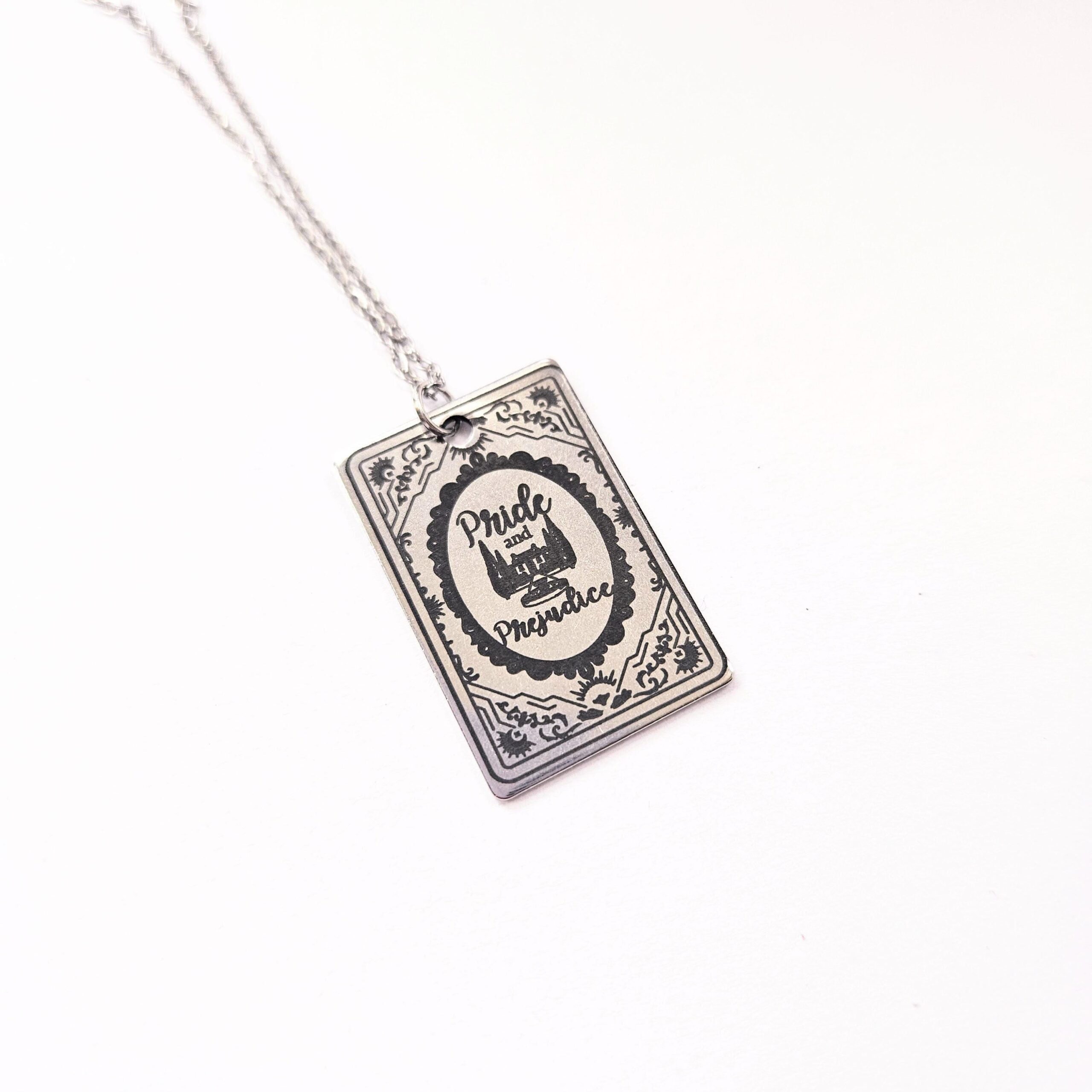 Miniature Pride and Prejudice book pendant — engraved stainless steel, mirror-polish finish. Jane Austen jewelry for the romantic reader. Tarnish-proof. "You have bewitched me, body and soul." 🥀📖 Whether you're a Lizzie or a Darcy, our Pride and Prejudice Book Necklace is the ultimate tribute to the world’s most famous enemies-to-lovers story. Crafted from high-grade 304 Stainless Steel and polished to a stunning mirror finish, this pendant is designed for the dreamers, the readers, and the ones (3)