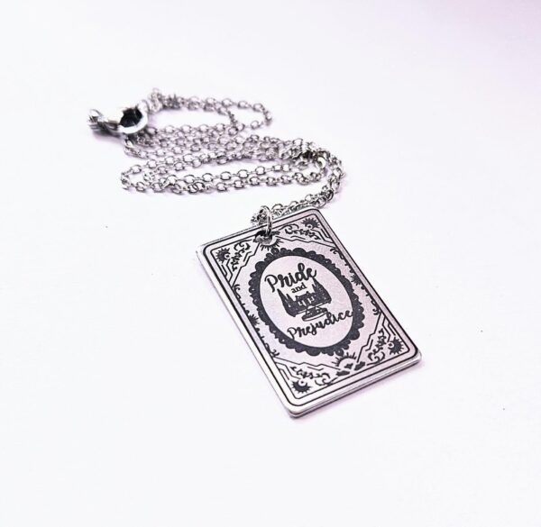 Pride and Prejudice Book Necklace – Jane Austen Literary Jewelry – Romantic Gift for Her 6 Miniature Pride and Prejudice book pendant — engraved stainless steel, mirror-polish finish. Jane Austen jewelry for the romantic reader. Tarnish-proof. "You have bewitched me, body and soul." 🥀📖 Whether you're a Lizzie or a Darcy, our Pride and Prejudice Book Necklace is the ultimate tribute to the world’s most famous enemies-to-lovers story. Crafted from high-grade 304 Stainless Steel and polished to a stunning mirror finish, this pendant is designed for the dreamers, the readers, and the ones (6)