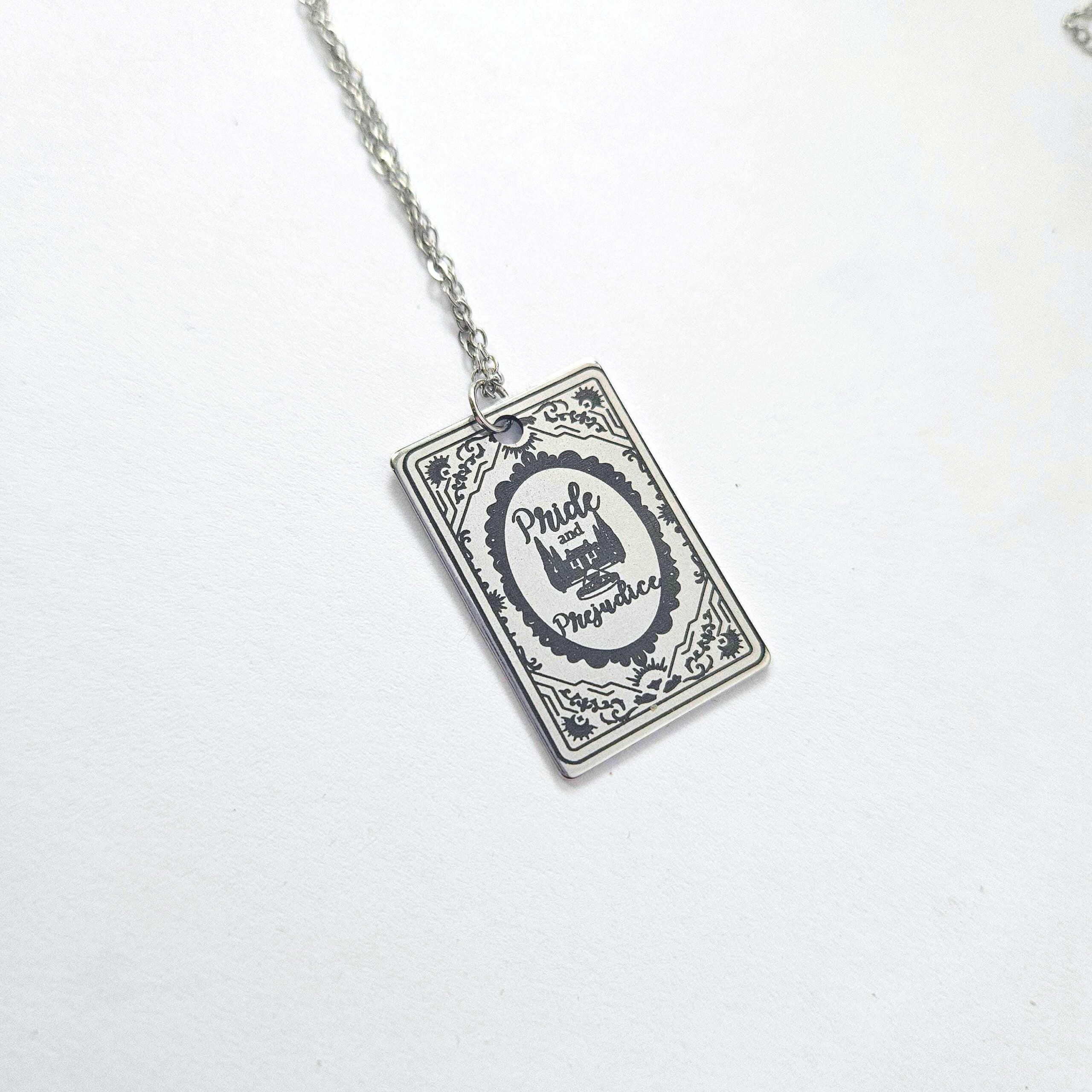 Miniature Pride and Prejudice book pendant — engraved stainless steel, mirror-polish finish. Jane Austen jewelry for the romantic reader. Tarnish-proof. "You have bewitched me, body and soul." 🥀📖 Whether you're a Lizzie or a Darcy, our Pride and Prejudice Book Necklace is the ultimate tribute to the world’s most famous enemies-to-lovers story. Crafted from high-grade 304 Stainless Steel and polished to a stunning mirror finish, this pendant is designed for the dreamers, the readers, and the ones (7)
