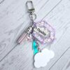 il_fullxfull.7629615421_syuh Opalite Bag Charm | Glow In The Dark Lightning Strike Keychain | Custom Engraved Gift