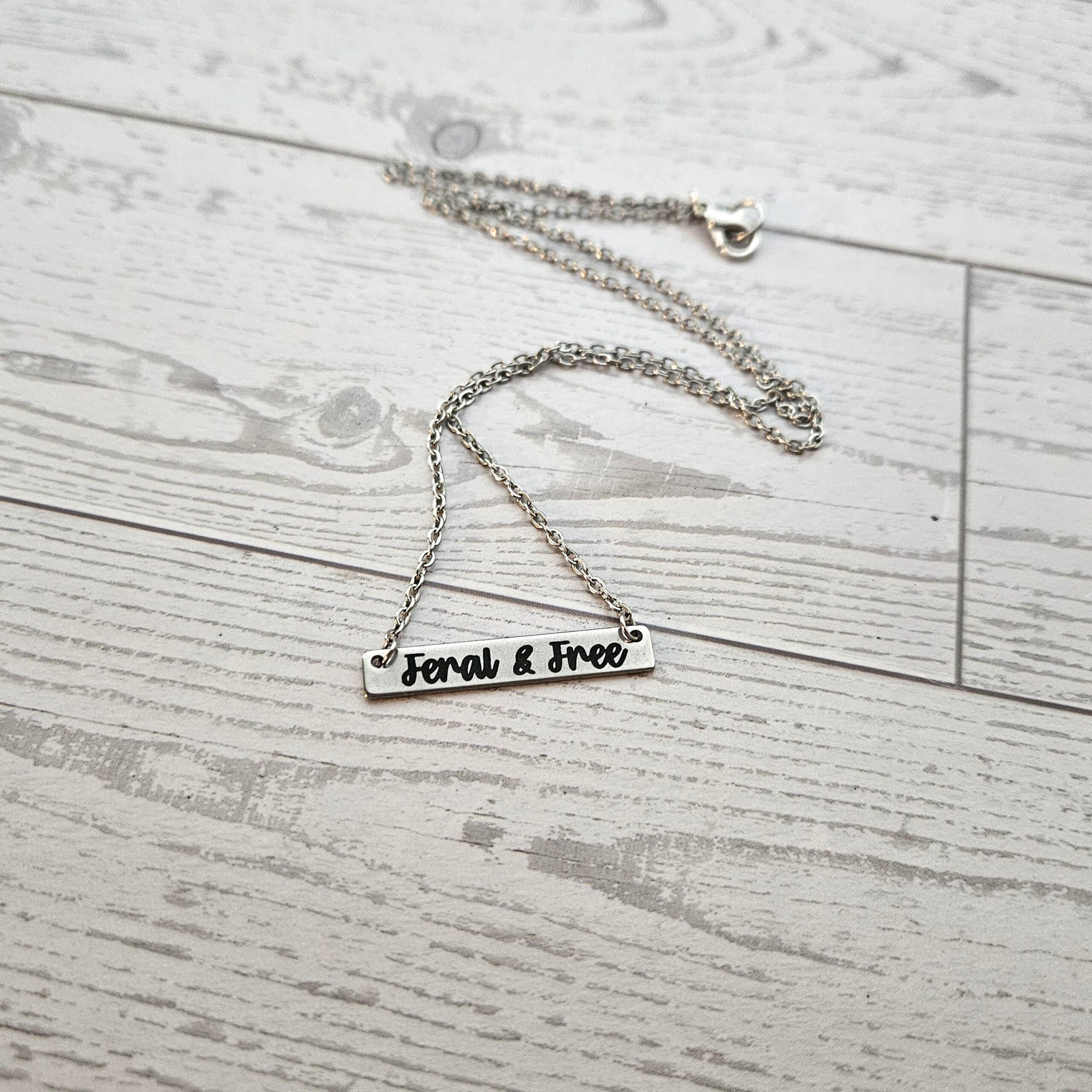 Feral and Free Necklace – Feminist Jewelry Gift – Stainless Steel Bar Pendant with Black Engraving - Image 2