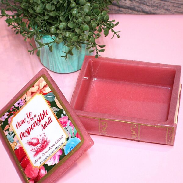 Funny Resin Book Box: 'How to be a Responsible Adult' - Handmade Storage for Book Lovers 8 Because responsibility can wait until the next pour. 🍷📖 Meet your new favorite secret stash spot—a stunning jelly rose red resin book box that’s equal parts classy and cheeky. Whether it’s perched on your bookshelf, desk, or bar cart, this handmade epoxy resin box is designed for those who appreciate a touch of luxury with their humor. Makes the perfect gift for you booktok bestie or yourself! ✨ Features: 📖 Crafted from high-quality tinted epoxy resin – with a translucent jelly rose red finish t (8)