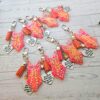 il_fullxfull.7629630547_m081-3 Orange Showgirl Era Keychain – Rhinestone Resin Bag Charm with Engraved Quote