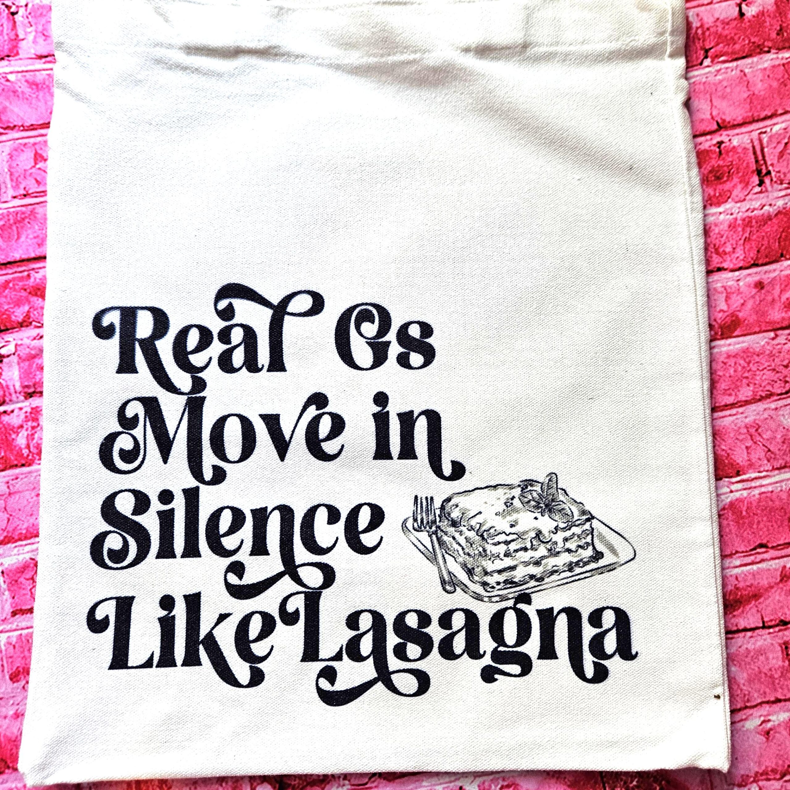 The perfect gift for the hip-hop fan or anyone who makes moves in silence! 🤫 Featuring the iconic "Real G's Move In Silence Like Lasagna" lyric, this premium sublimated tote bag is as functional as it is funny. Why this tote stands on business: 💼 Permanent, Vibrant Art: We use sublimation, meaning the ink is dyed directly into the cotton canvas fibers. It’s smooth to the touch and will never fade, peel, or rub off. 🧼✨ Premium Construction: Made from high-quality, medium-weight cotton canvas. It’ (3)