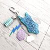 il_fullxfull.7684103596_sz0j-1 Opalite Era Showgirl Bag Charm • Custom Lyric Engraved Heart or Glow-in-the-Dark Lightning Bolt
