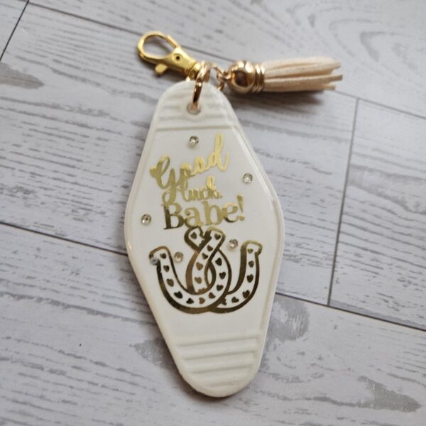 il_fullxfull.7721114827_f6xs-1 Good Luck Babe Keychain: Chic White Gold Design - Cream Tassel