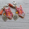 il_fullxfull.7853682808_ds3z-2 Orange Showgirl Era Keychain – Rhinestone Resin Bag Charm with Engraved Quote
