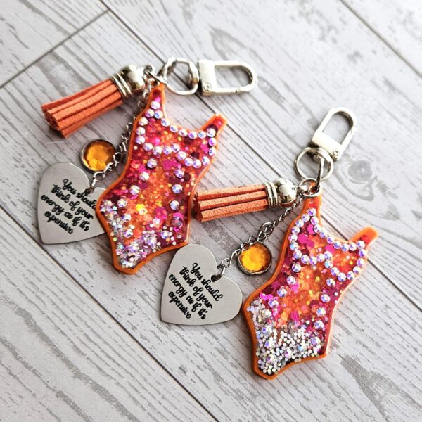 il_fullxfull.7853699924_2rmt Orange Showgirl Era Keychain – Rhinestone Resin Bag Charm with Engraved Quote