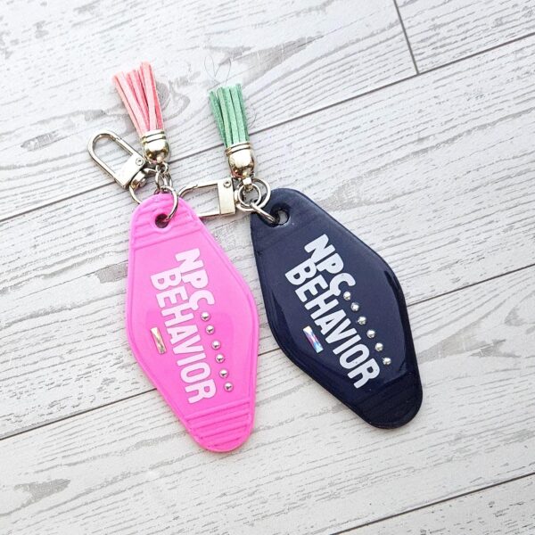 il_fullxfull.7857222248_gc32 NPC Behavior Resin Motel Keychain, Funny Meme Bag Charm, Sarcastic Gift for Her
