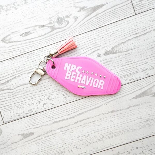 il_fullxfull.7857223612_6mq8-1 NPC Behavior Resin Motel Keychain, Funny Meme Bag Charm, Sarcastic Gift for Her