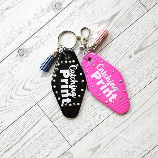 Catching Print Motel Keychain — Funny Cheeky Bag Charm with Studs and Tassel 2 Catching Print Motel Keychain — Funny Cheeky Bag Charm with Studs and Tassel