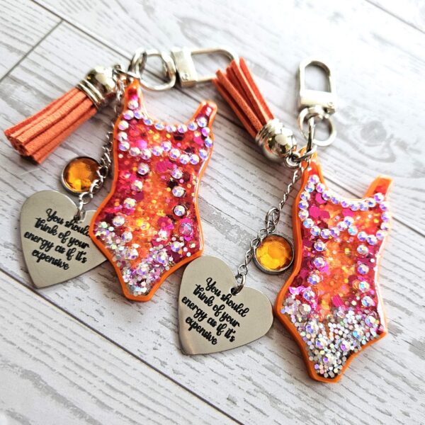 il_fullxfull.7901648819_isdl-2 Orange Showgirl Era Keychain – Rhinestone Resin Bag Charm with Engraved Quote