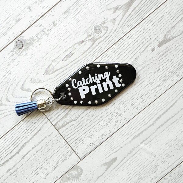 Catching Print Motel Keychain — Funny Cheeky Bag Charm with Studs and Tassel 4 Catching Print Motel Keychain — Funny Cheeky Bag Charm with Studs and Tassel